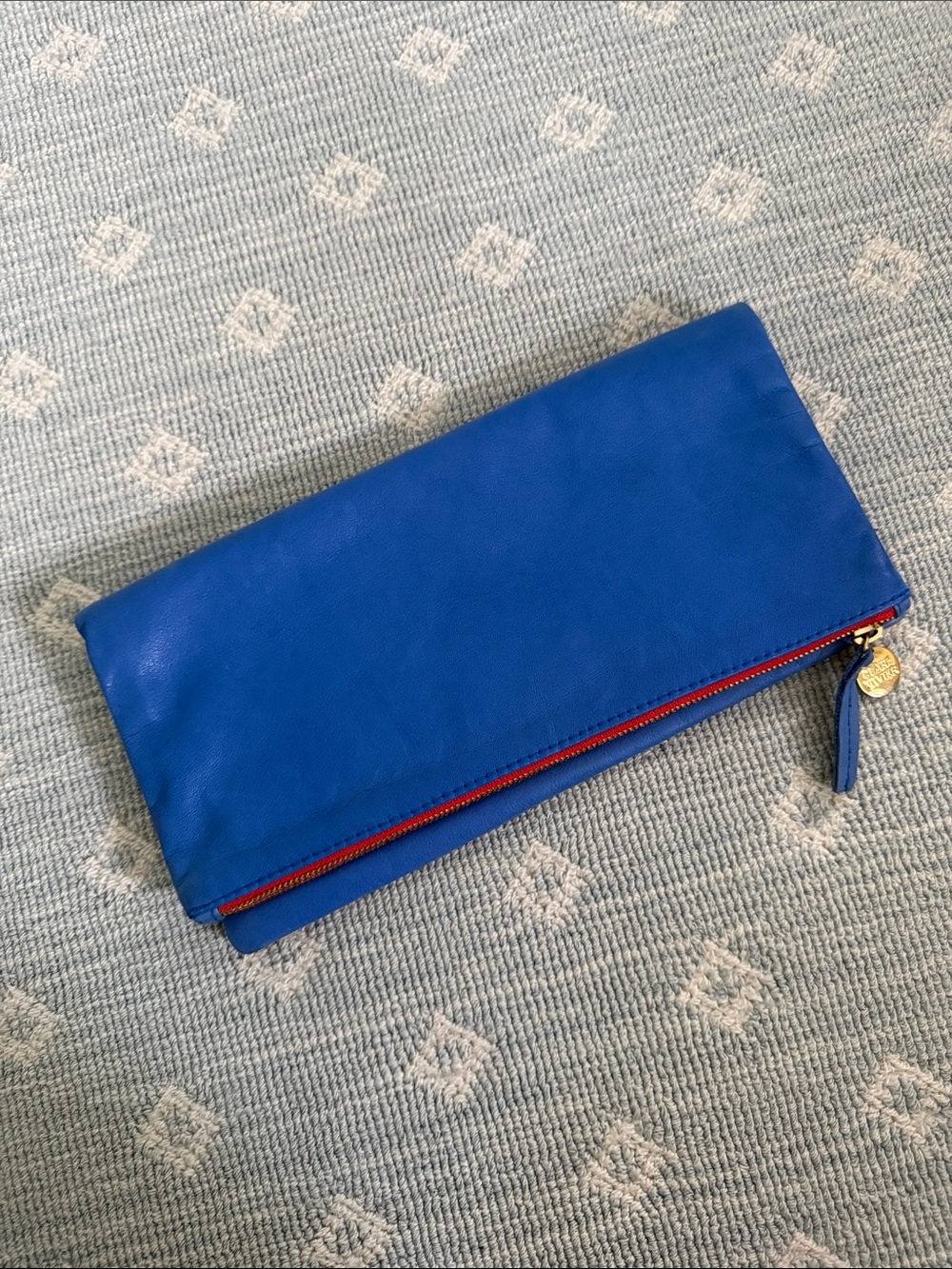 Vintage Clare V. Bold Blue Fold-Over Leather Clutch with Red Zip Accent